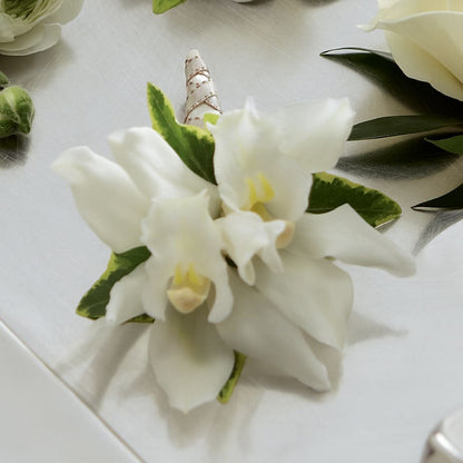 White Mini Cymbidium Boutonniere –  Rhonda Wolke Designs, Ottawa OH